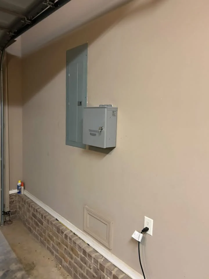 Electrical panel and connection equipment mounted on a garage wall